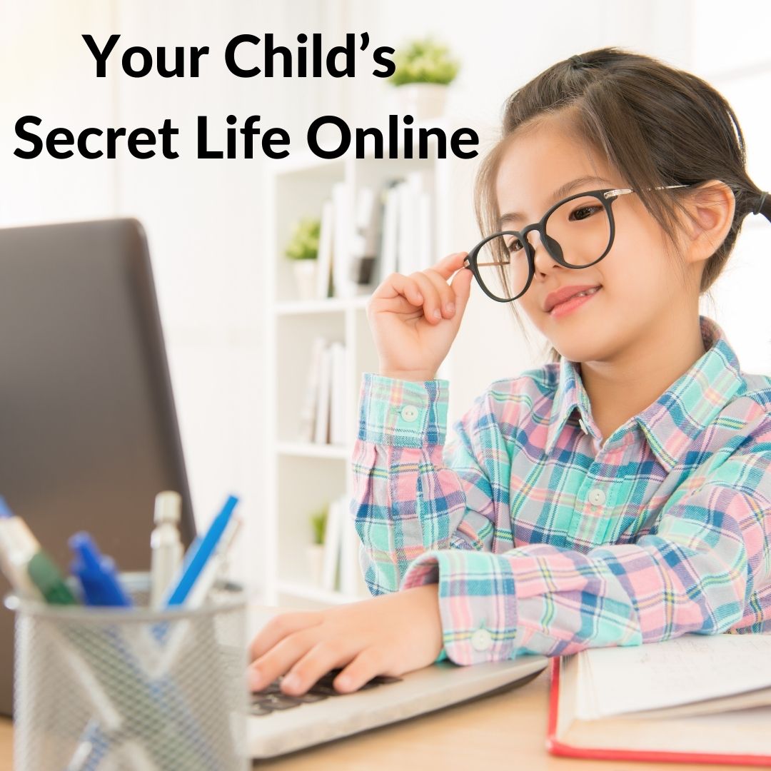 child looking at a laptop
